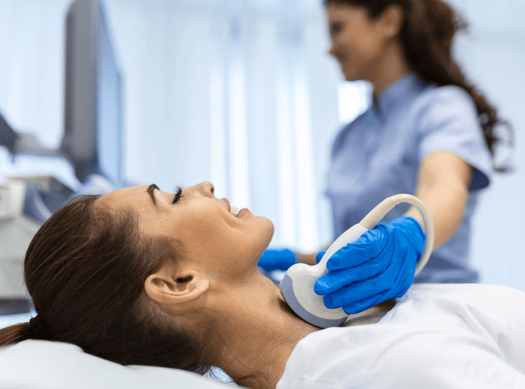 Patient relaxing during a thyroid ultrasound exam